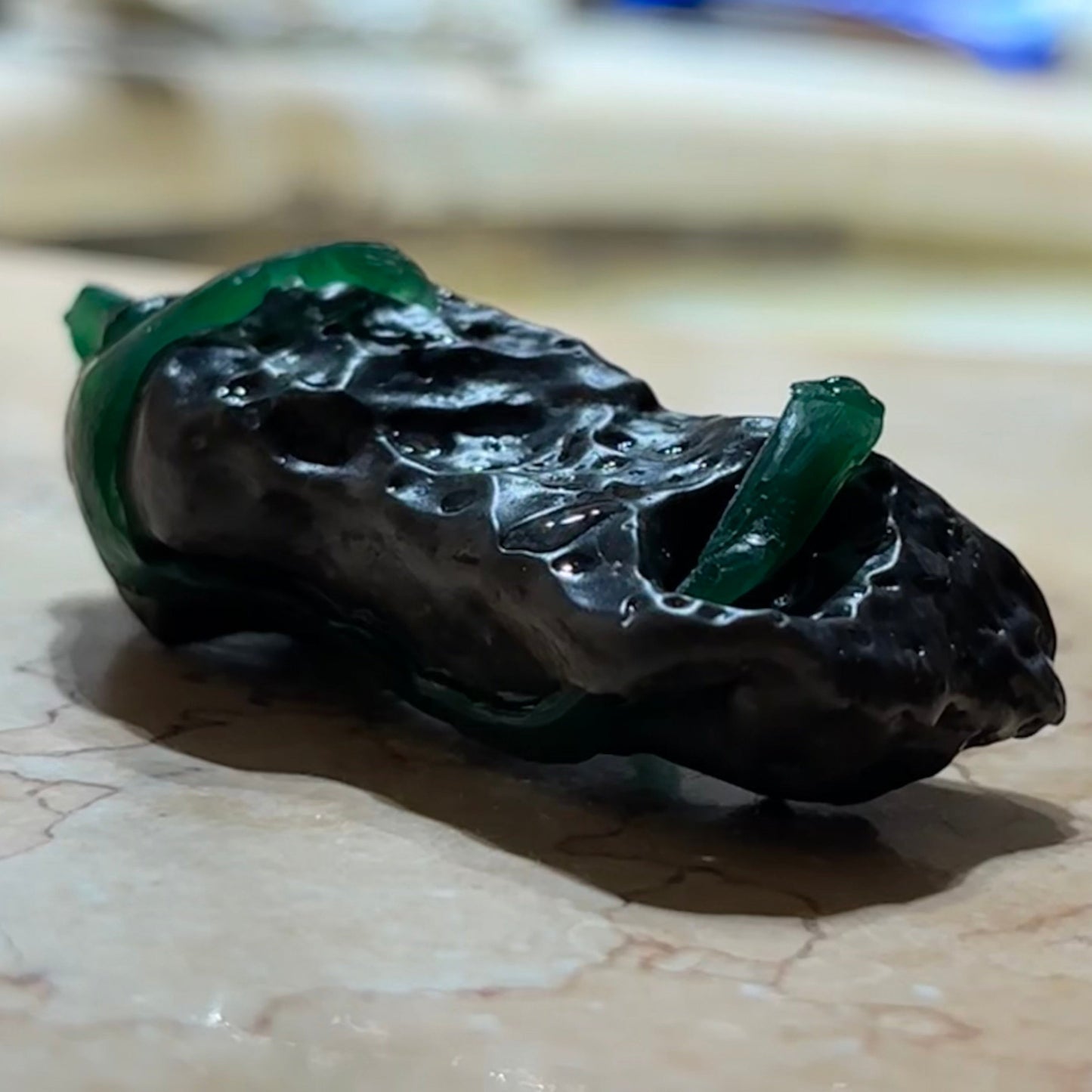 Black stone with the setting in wax the shape is followed