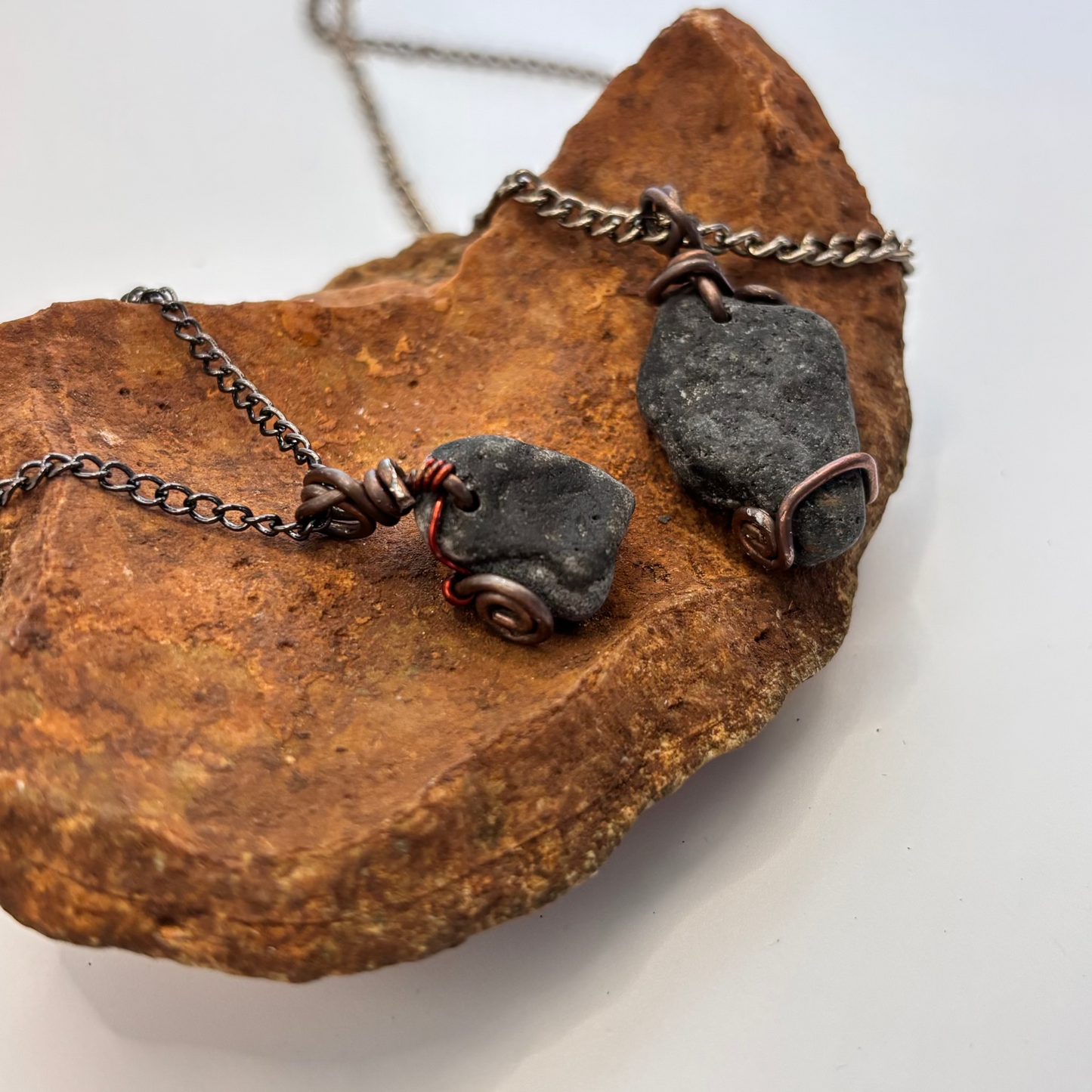 Midnight Shore necklace styled flat lay on black chain