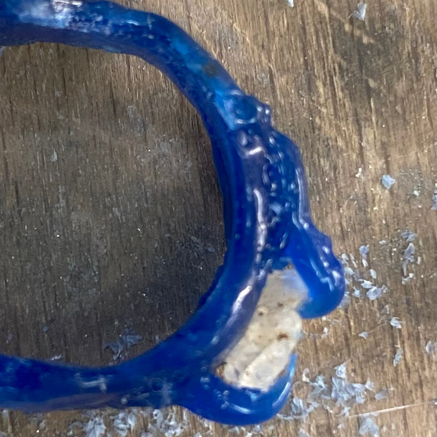 Side view of calcite ring showing organic silver lines in wax