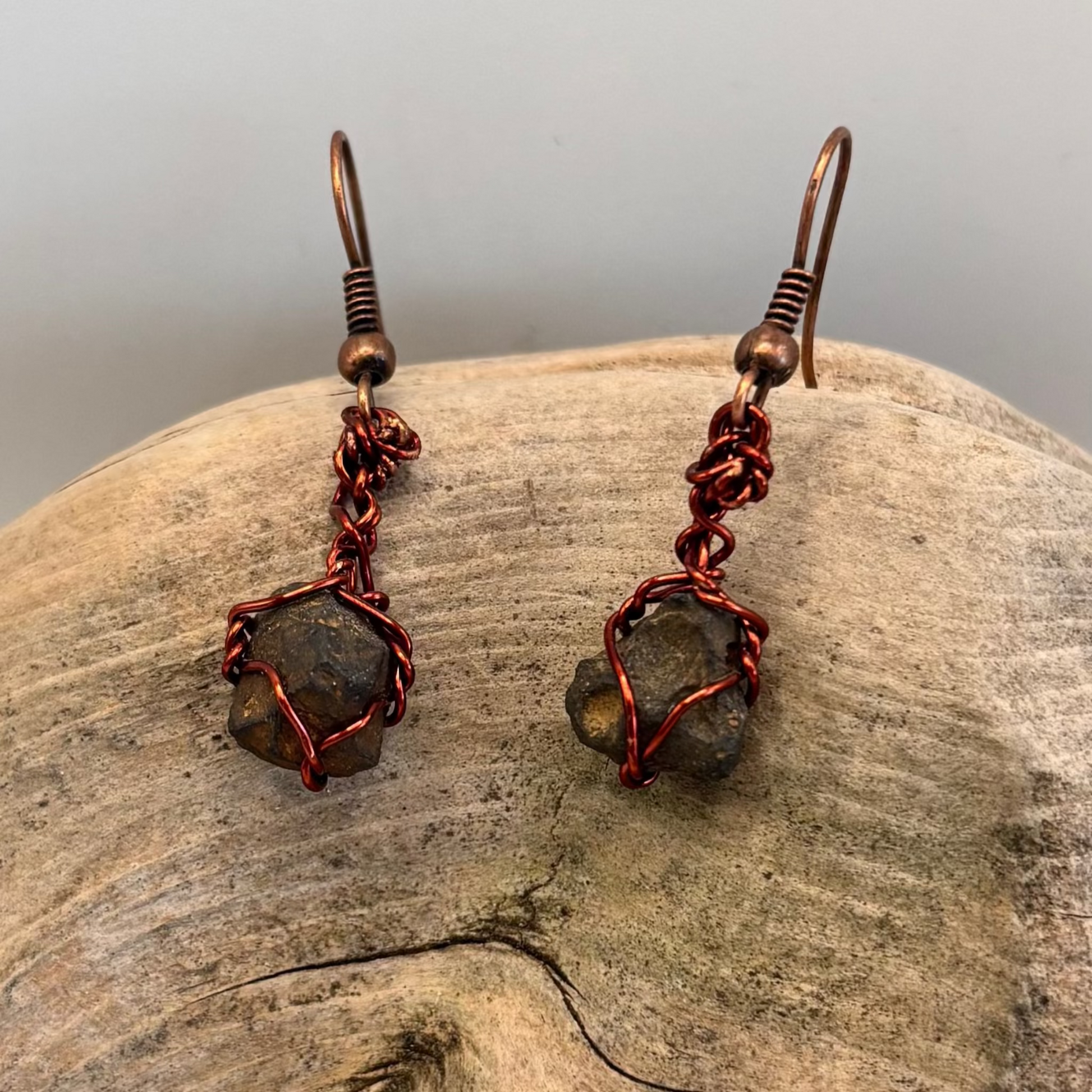Pair of raw iron ore earrings wrapped in red wire - handmade jewelry