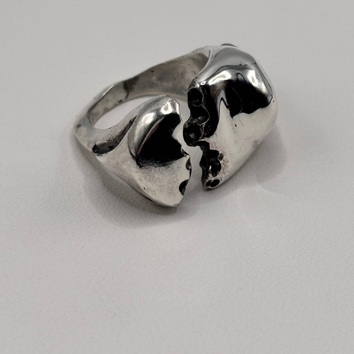 Close-up of The Split sterling silver ring with white sea glass detail.