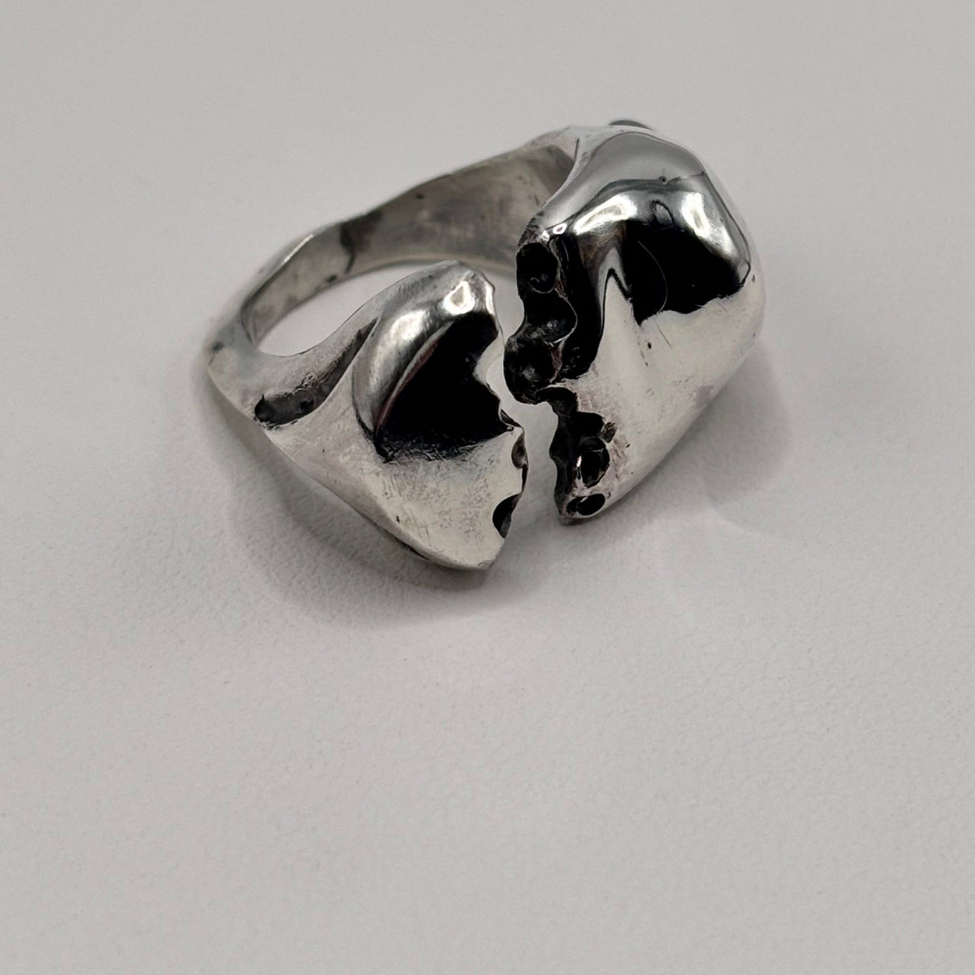 Close-up of The Split sterling silver ring with white sea glass detail.