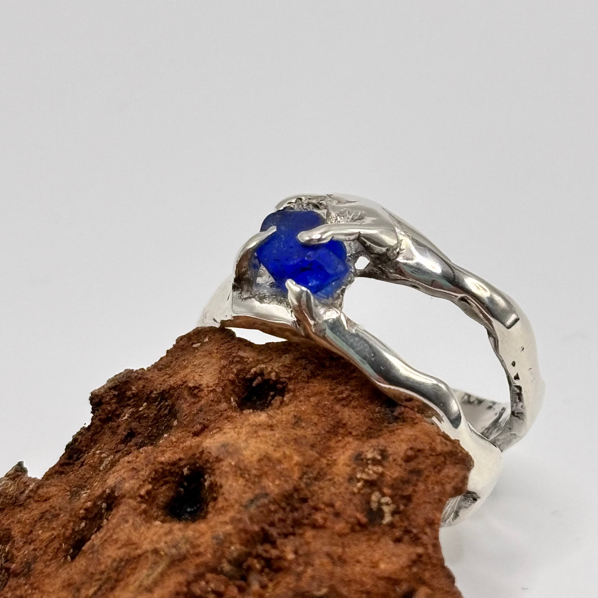 Silver ring with rare blue sea glass stone on display