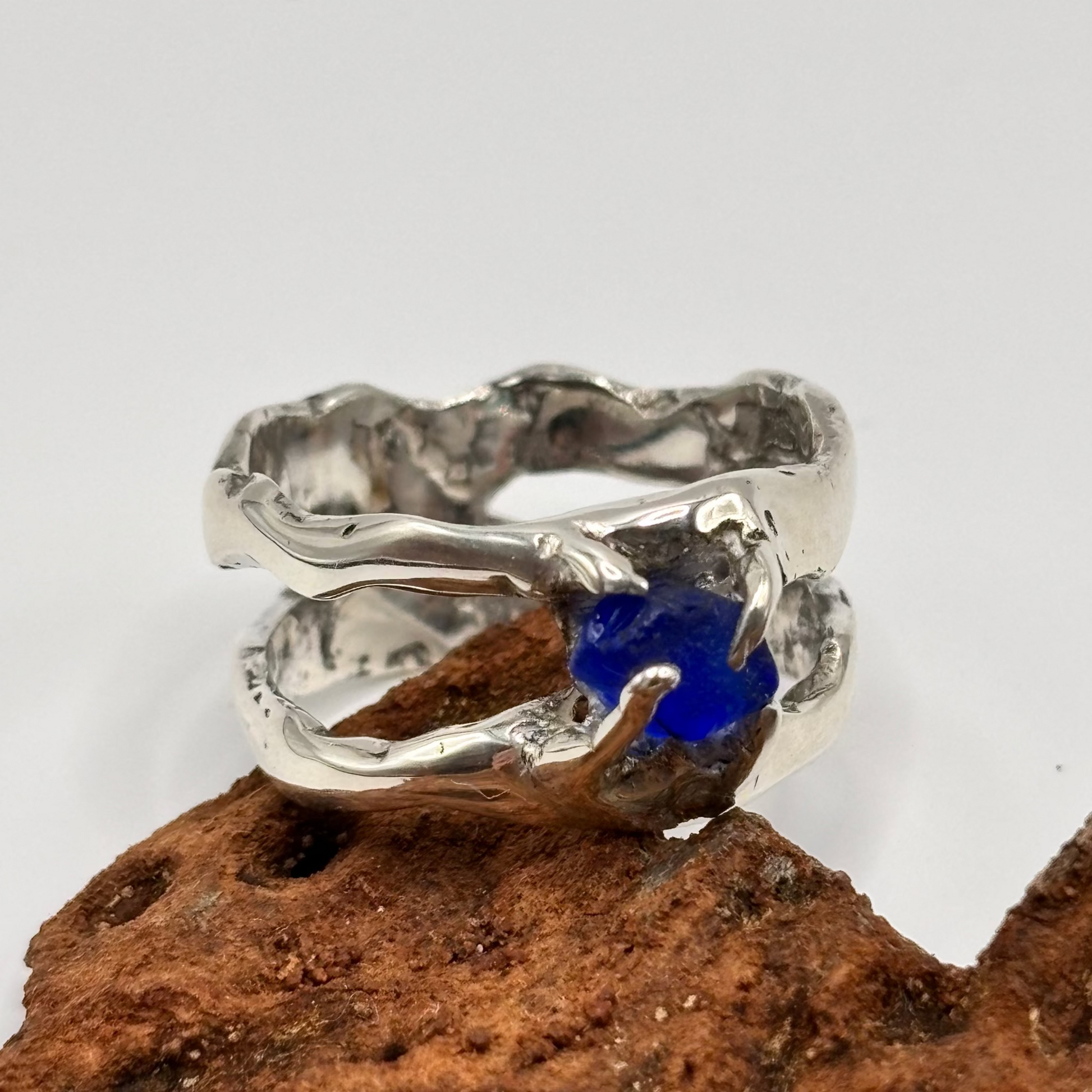 Close-up of blue sea glass ring showing lost wax casting detail