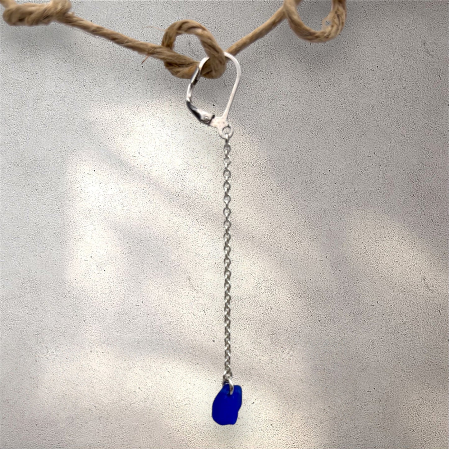 Azure earring, blue sea glass on silver chain.