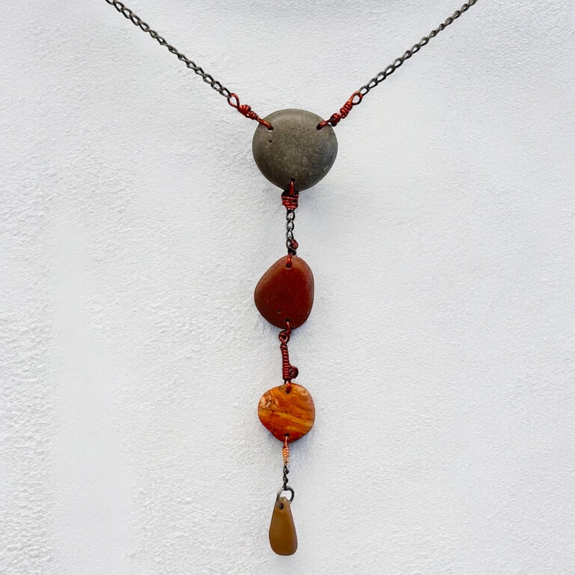 Four raw beach stones wire wrapped together into one pendant necklace