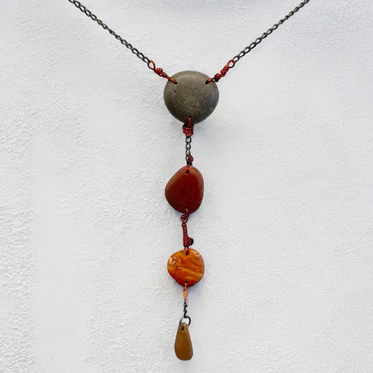 Four raw beach stones wire wrapped together into one pendant necklace