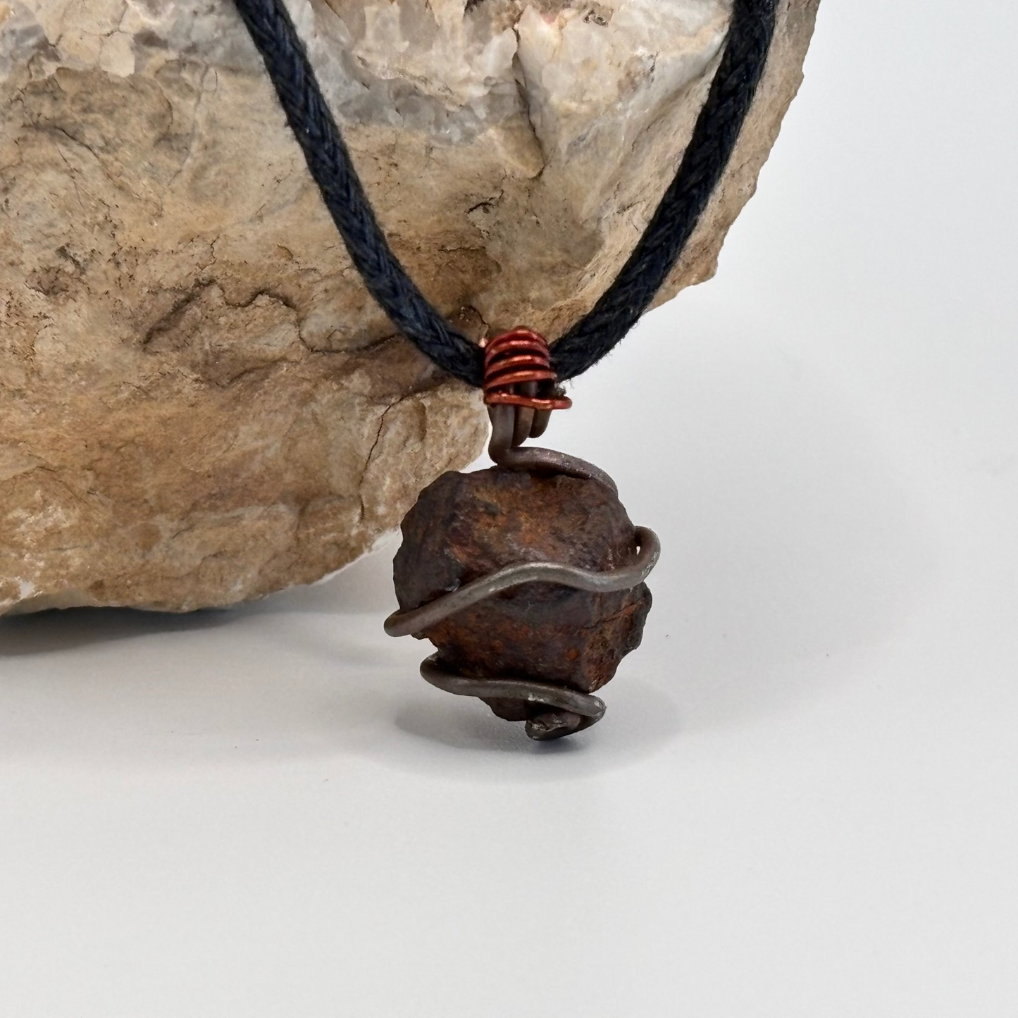 Raw iron ore stone wrapped in copper and red wire necklace pendant