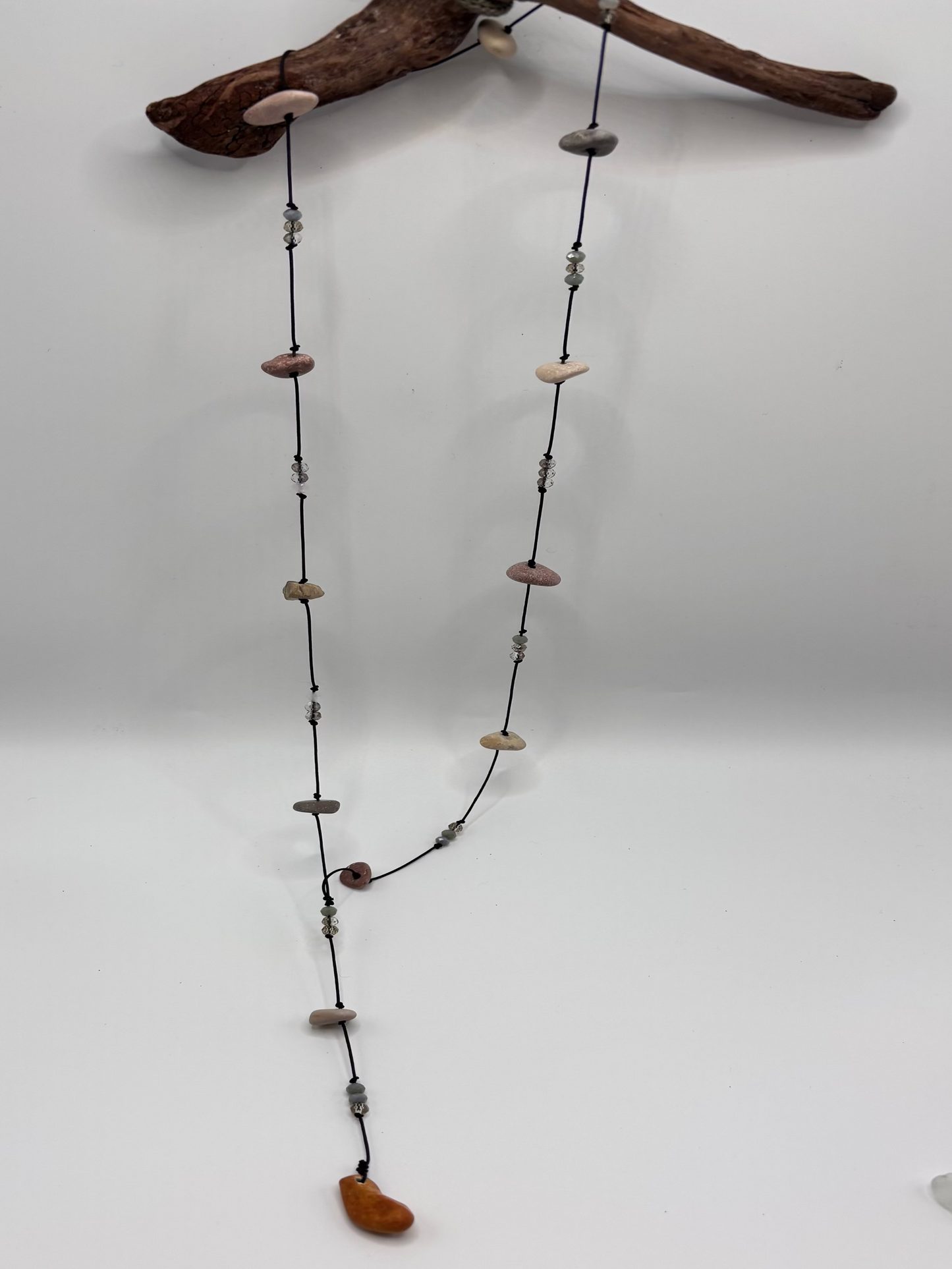 Necklace with natural beads on a white background
