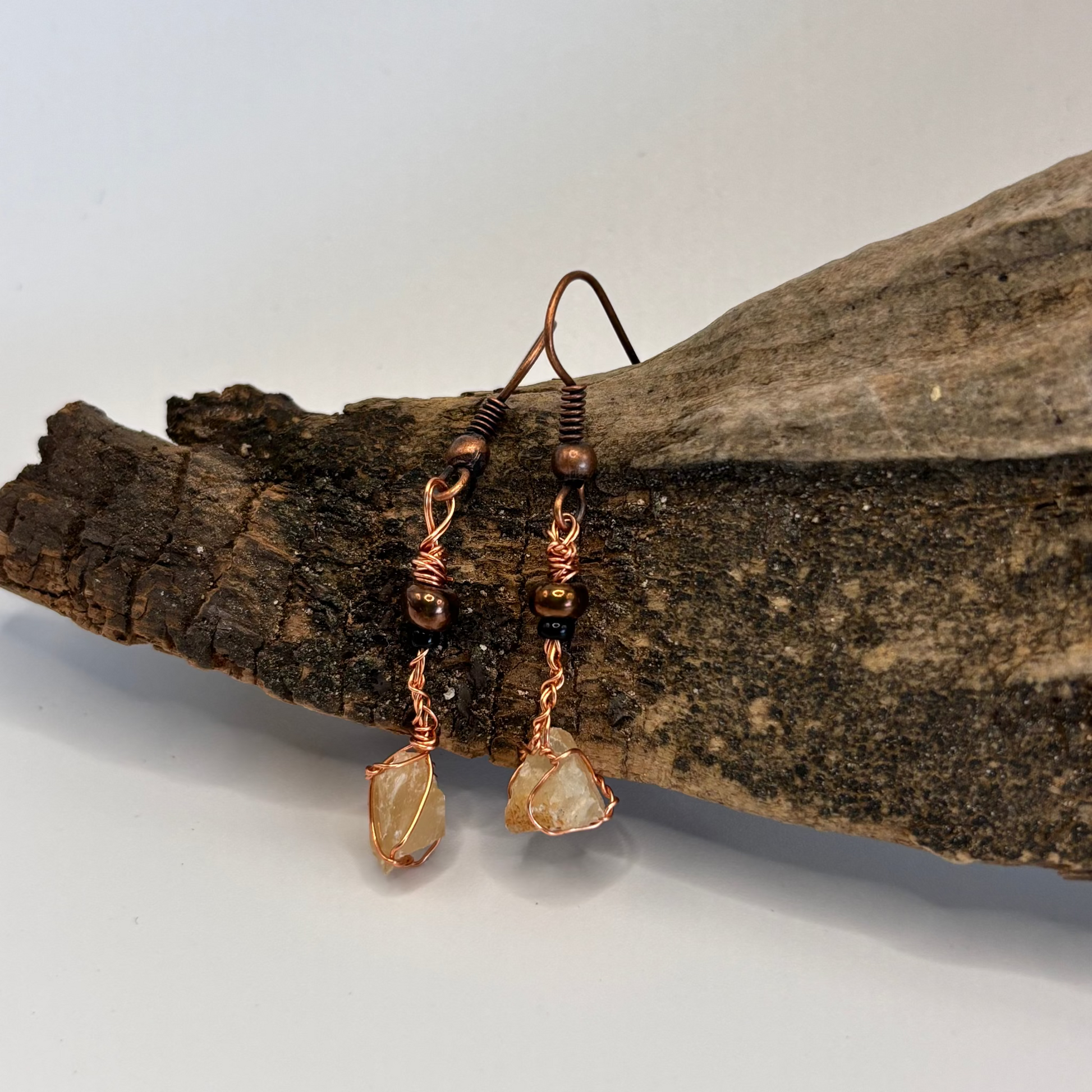 Close-up of raw calcite wire wrapped earring detail
