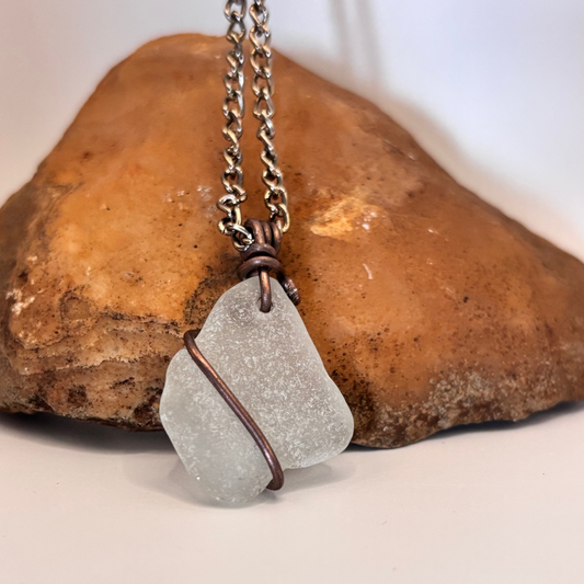 Close-up of copper wire wrapped sea glass necklace