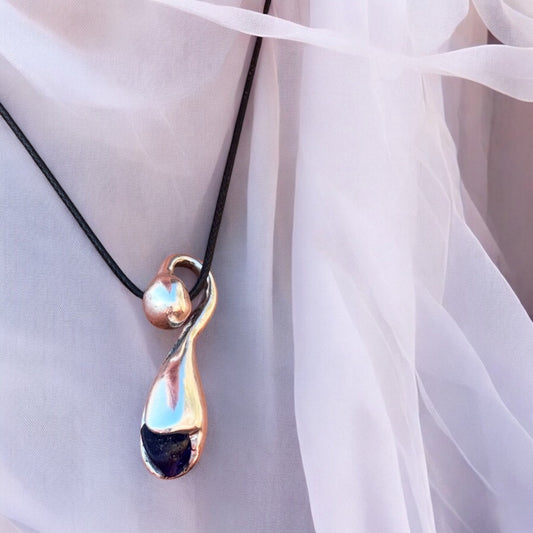 Silver pendant with deep blue sea glass, nature-inspired design