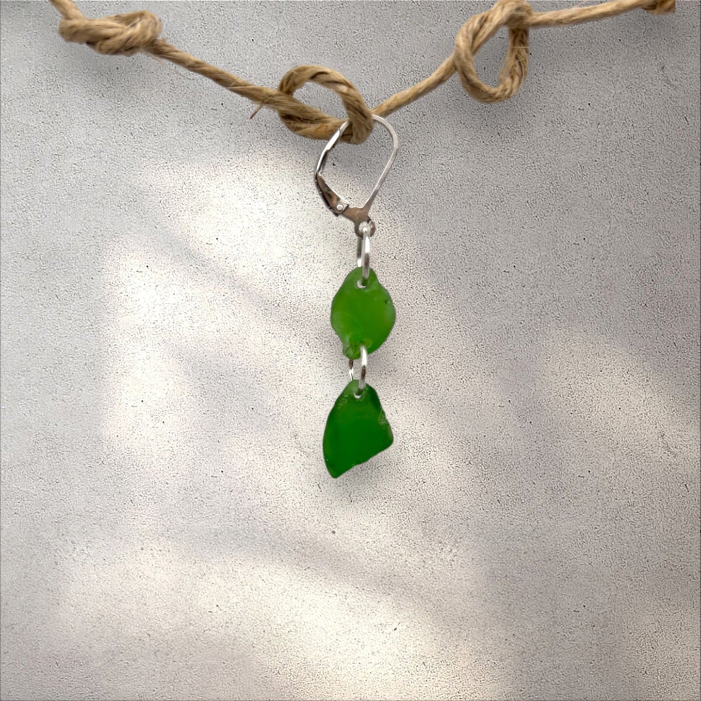 Sea Duet earring, two green sea glass pieces in silver