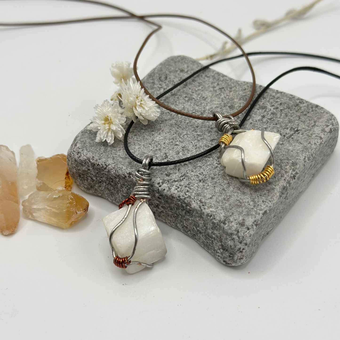 White stone wire wrapped pendant on adjustable cord, side view