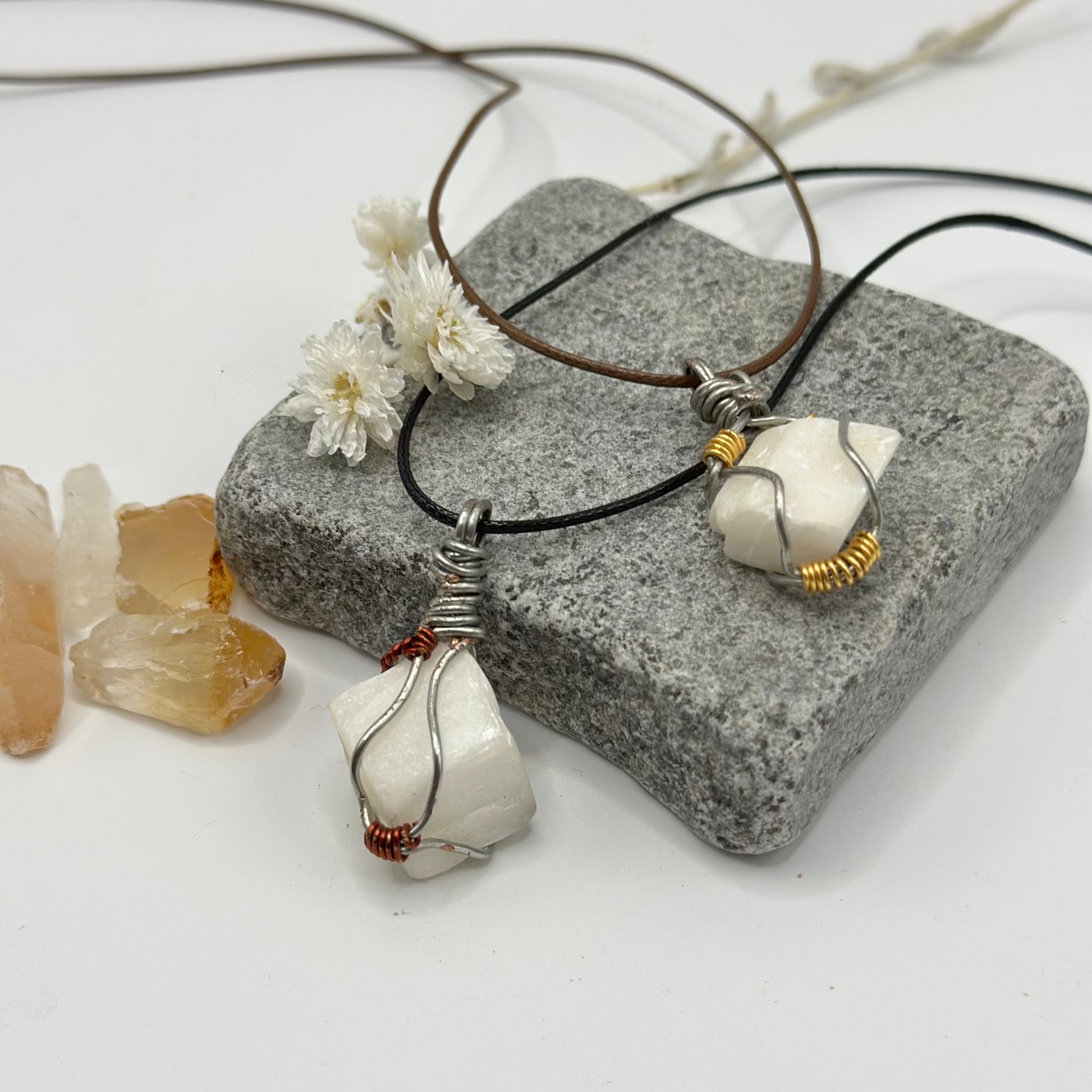 White stone wire wrapped pendant on adjustable cord, side view